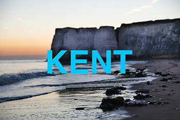 A picture of the white cliffs of Dover with the label Kent over the top